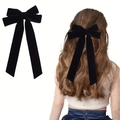 Long black velvet double bow hair clip with streamers shown on model and white background - Black