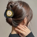 Elegant black hair claw clip with yellow sun and moon print shown on model's hair - Sun Style (2)