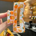 Square cream hair claw clip with vibrant orange print and strong metal spring - Orange Style