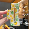 Square acetate hair claw clip with fresh yellow lemon print and marble texture finish - Lemon Style