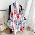 Elegant white floral silk scarf with red and blue ink patterns on a modern grey chair - Light Red