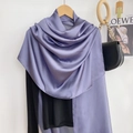 Detail of lavender satin scarf showing silky texture and elegant drape on a hanger - Purple