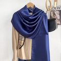 Detail of navy blue silk scarf with classic check border paired with khaki shirt - Navy Blue