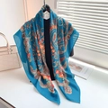 Detail of royal blue paisley scarf with soft texture and elegant camellia brooch accessory - Paisley Print With Camellia Decoration / Sky Blue (110RZW008-2)