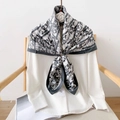 Detail of elegant black and white silk scarf draped over a chair with abstract print - 90x90cm / Navy Blue