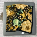 Close-up of vintage floral print square scarf with delicate frayed edges and brand tag - 130x130cm / Black