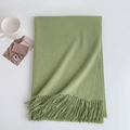 Detail shot of avocado green cashmere-feel scarf with delicate fringe on white background - 185x70cm / Light Green