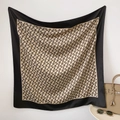 Detailed view of luxury twill silk scarf with letter monogram print and black borders - 90x90cm / Black Coffee