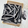 Elegant 70cm black square silk scarf with chain pattern on a gold decorative tray - Black