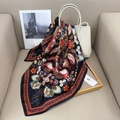 Detail of paisley print silk scarf in black and red draped on a white leather bag - 70x70cm / Black
