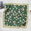 Flat lay of floral silk square scarf in dark green on marble table with fashion magazine - Dark Green Pink Floral (58FJ95-4)