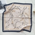 Detail of silk-like square scarf with floral pattern and striped border on marble - Beige Black Branch Leaves (58FJ91-2)