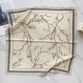 Detailed view of floral faux silk square scarf with elegant leaf print and satin finish - Cream Yellow Flower Branch (58FJ91-4)