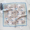 Flat lay detail of 58cm silk scarf with floral tulip patterns and blue geometric borders - Sky Blue Small Floral (58FJ92-1)