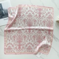 Detail view of a 58cm silk scarf with pink baroque floral patterns on marble - White Pink Baroque (58FJ93-4)