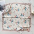 Detail of silk-feel floral square scarf with elegant floral prints and a brand tag - Pink Edge Beige Grid (58FJ94-2)