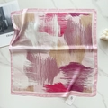 Detailed flat lay of a pink silk square scarf with abstract artistic texture and magazine - Pink Abstract Strokes (58FJ89-6)