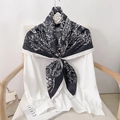 Elegant 90cm black and white floral silk scarf styled on a white chiffon shirt - 90x90cm / Black