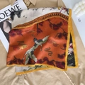 Detail of velvet scarf featuring flying crane patterns and traditional Chinese aesthetics - Yellow