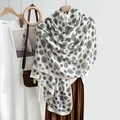 White camellia flower pattern scarf with black edges shown in a stylish fashion outfit - Rectangle / White
