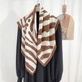 Elegant silk-like square scarf featuring coffee zebra stripes on a black dress - Large / Red Brown