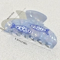 Blue whale hair claw clip with floral fish patterns in iridescent pearl finish - Blue