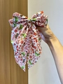 Detail of white Christmas bow clip with snowman prints and Let It Snow festive typography - White