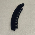 Detail view of black flocked banana hair clip with dense comb teeth for thick hair - Black