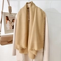 Elegant khaki solid scarf with fine tassel detail draped over a wool coat for a chic look - Earth Yellow (130 Frayed Solid Color) / Standard