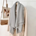 Elegant medium gray solid scarf with long fringe details shown over a wool coat - Gray (130 Frayed Solid Color) / Standard