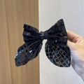 Fermaglio per capelli a fiocco con paillettes nere lucide e riflessi brillanti per bimba - Nero