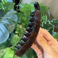 Close-up of a tortoiseshell banana hair clip with multi-teeth design for thick hair - Dark Tortoiseshell