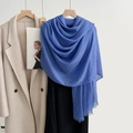Solid blue cotton linen scarf with fine fringe tassels styled on a beige trench coat - Royal Blue