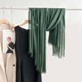 Deep green cotton linen scarf with fine fringe trim displayed on a clothes rack - Ink Green (11#)