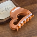 Large amber hair claw clip in a glossy finish for thick hair with a vintage style - Sunset Orange