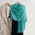 Elegant mint green linen scarf with fringes styled over a black garment and beige coat - Peacock Blue (44#)