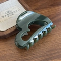 Elegant dark green acrylic pumpkin hair claw clip with glossy finish on wooden background - Dark Green