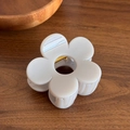 Elegant cream white flower hair claw clip with golden spring on dark wood surface - Large / Gray