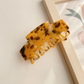 Classic large amber tortoiseshell hair claw clip in a glossy minimalist resin finish - 9.8CM / Amber Yellow