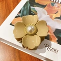 Elegant beige flower hair claw clip with white pearl center and golden twisted metal frame - Khaki