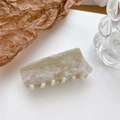Elegant rectangle acetate hair claw clip with marble texture and gold France label - Off-White