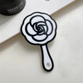 Elegant black and white camellia flower hand mirror with glossy resin finish for hair styling - Mirror-12.5cm