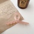 Pince à cheveux en acétate marbré rose avec design croisé élégant pour coiffure - Style Ruban / Orange