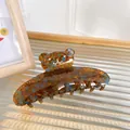 Amber resin hair claw clip with rhinestone bear design and tortoiseshell pattern - Blue Brown