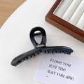 Glänzende schwarze Haarklammer mit Goldetikett für elegante Hochsteckfrisuren - Groß / Schwarz