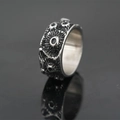 Punk style stainless steel ring featuring vintage crater texture and polished interior - US 7