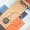 Gold stainless steel handcuffs bracelet with a chunky Cuban chain and adjustable lobster clasp - Gold