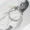 Minimalist silver Figaro chain bracelet with cross pendant and golden emblem center - Steel