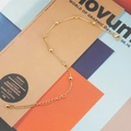 Minimalistische goudkleurige titaniumstalen armband met hartjes en kralen voor dames - Goud
