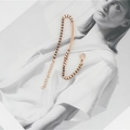 Elegante bracciale in acciaio titanio oro rosa con barra curva e maglia veneziana - Oro rosa